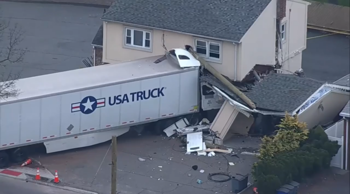cab of the truck embedded in the building wreckage