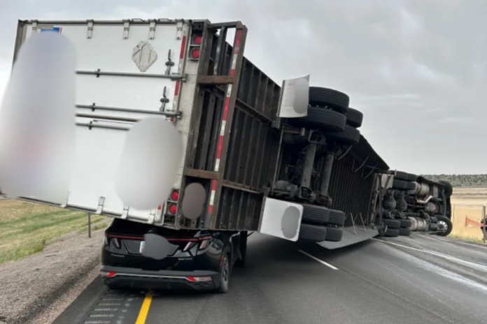 High Winds Blow Semi Onto SUV