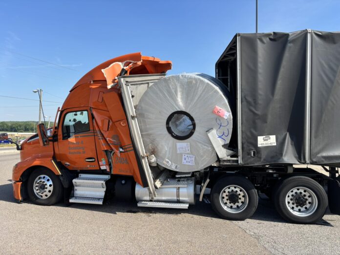 Aluminum Coil Shifts Forward Into Semi Cab o