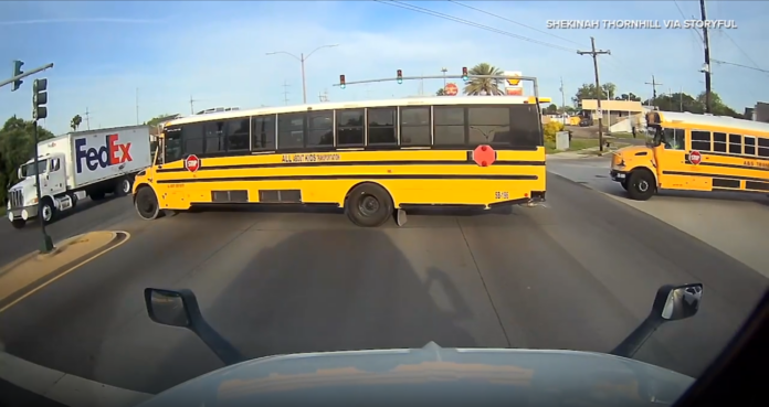 School Bus Runs Red Light in Front of Semi