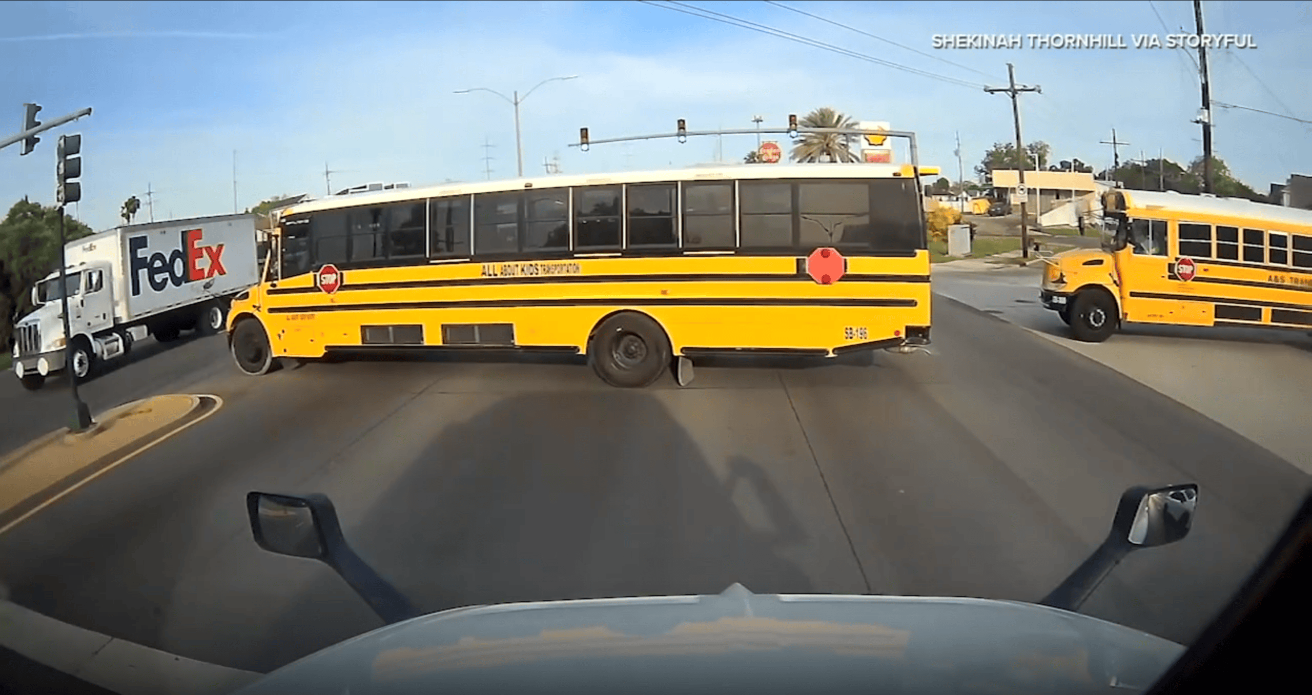 School Bus Runs Red Light in Front of Semi