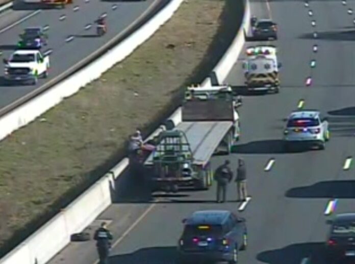 Driver Pinned Between Tractor-Trailer and Traffic Barrier