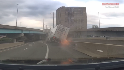 truck crashed into a wall and caught fire