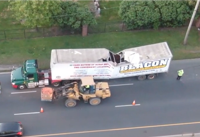 Scrap Metal Trailer Carrying Copper Buckles and Collapses in Linden