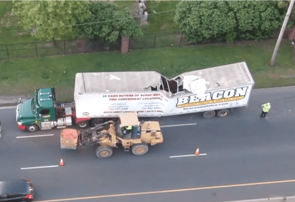 Scrap Metal Trailer Carrying Copper Buckles and Collapses in Linden